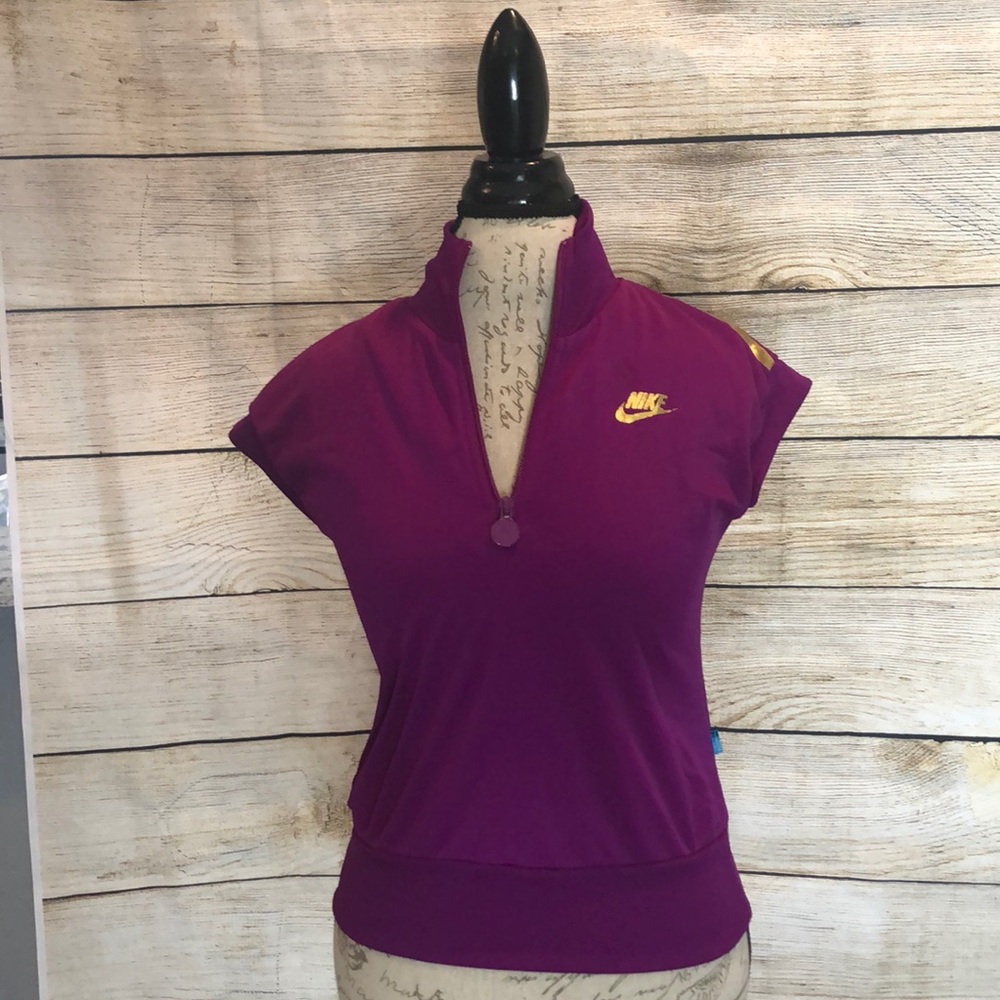 Nike work out top. Gold embellishment.